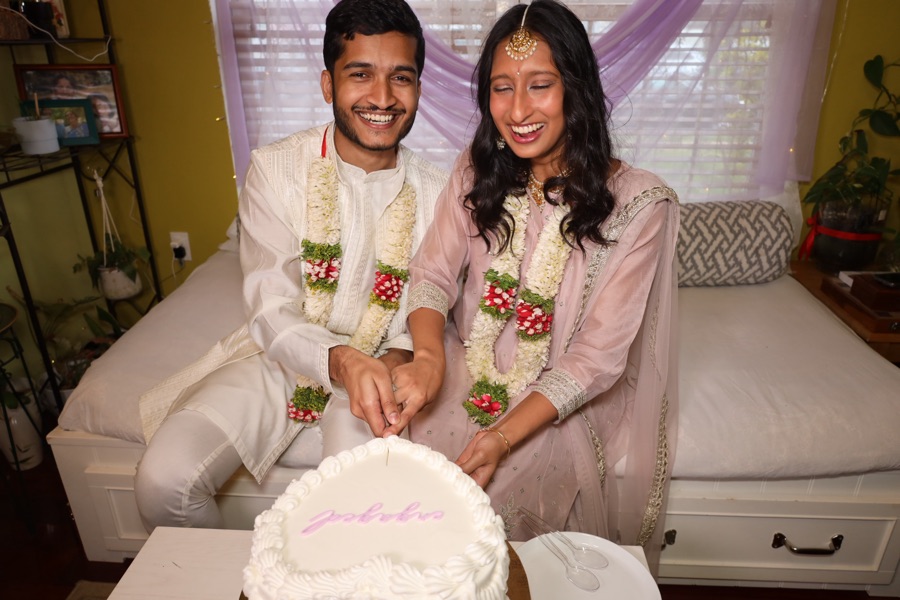 Rajul and Abdullah cutting their engagement cake