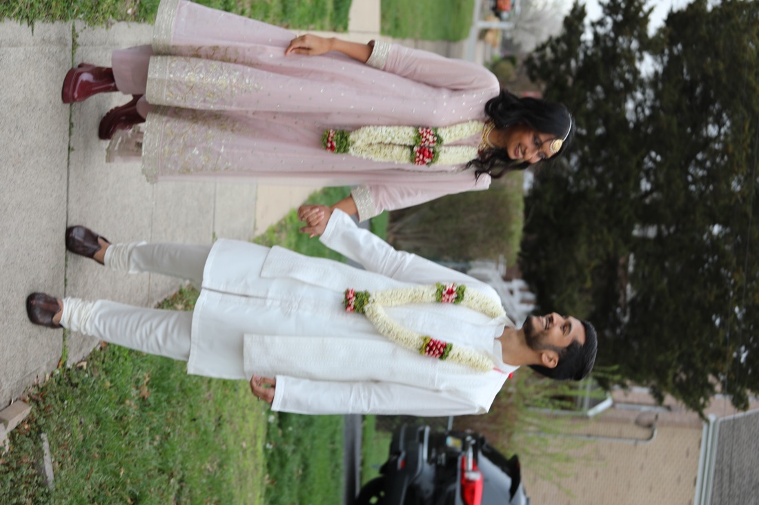Rajul and Abdullah walking hand in hand
